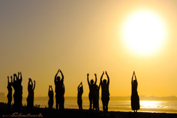 Group sun salutation Apura Yoga